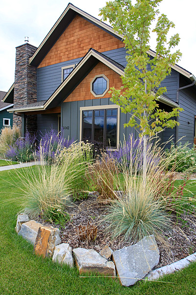 Natural stone retaining wall with native plantings